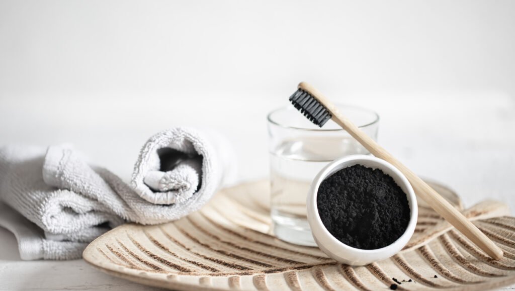 Organic toothbrush, charcoal powder. Charcoal toothpaste won't whiten your teeth in Brentwood.
